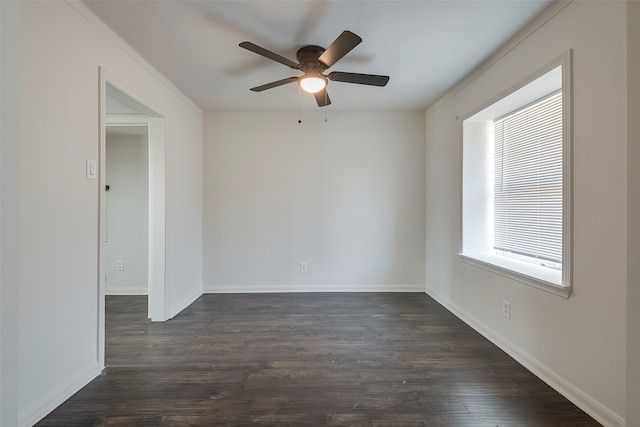 unfurnished room featuring dark wood-type flooring and ceiling fan