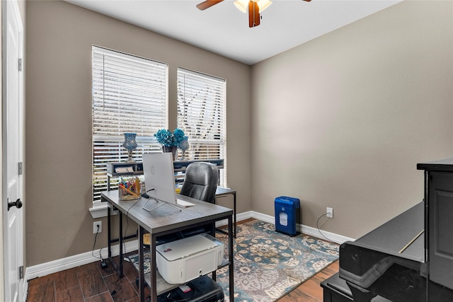 office area featuring dark wood-type flooring and ceiling fan