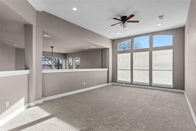 spare room with ceiling fan and carpet floors