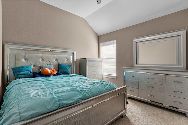 carpeted bedroom featuring vaulted ceiling