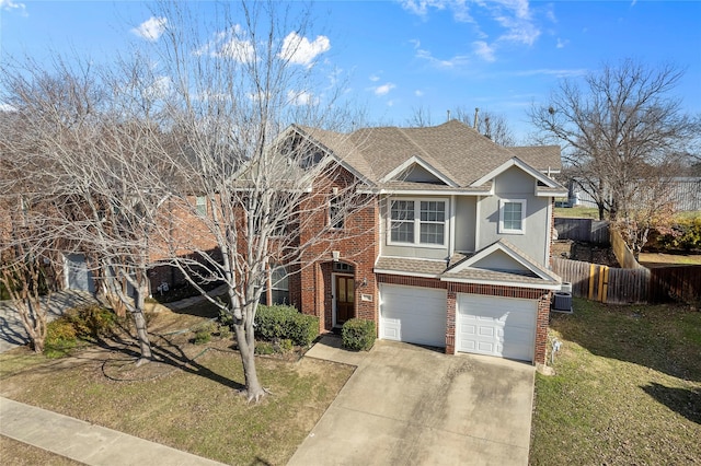 view of front of house featuring a front yard, a garage, and cooling unit