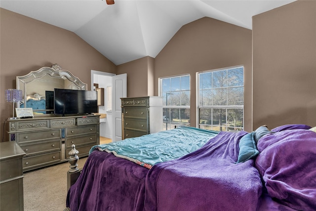 bedroom with ceiling fan, light carpet, and vaulted ceiling