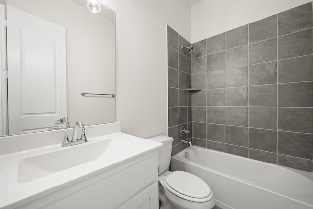 bathroom featuring vanity, toilet, and shower / washtub combination