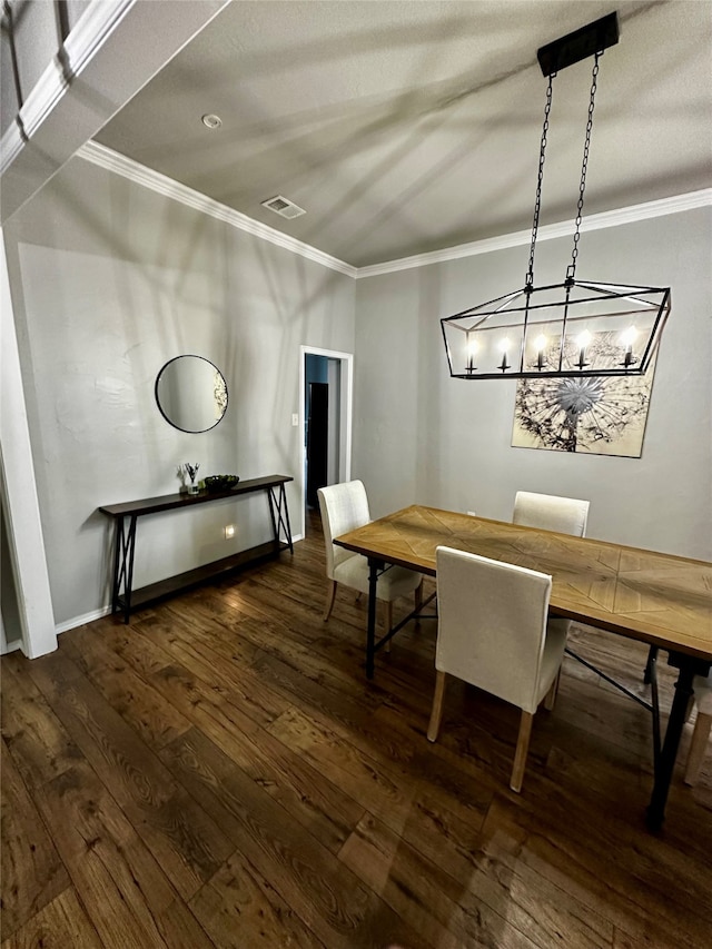 unfurnished dining area featuring ornamental molding and dark wood-type flooring