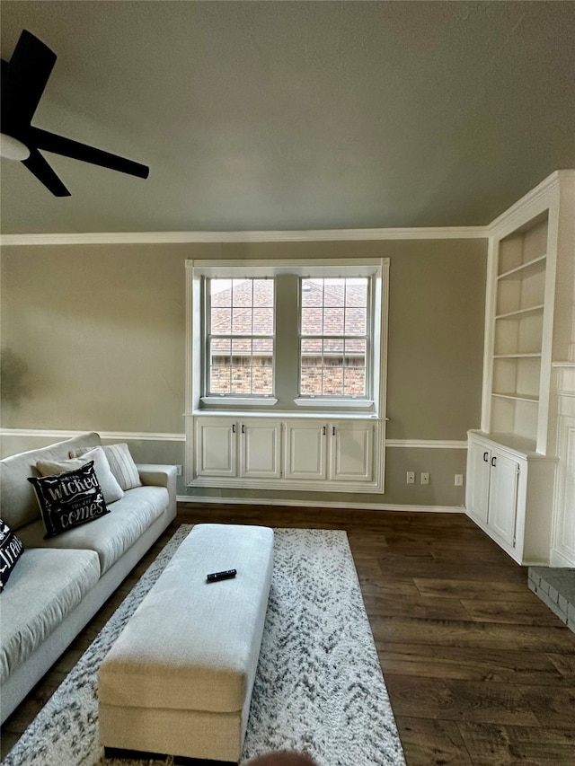 living room with dark wood-type flooring, crown molding, a textured ceiling, and ceiling fan