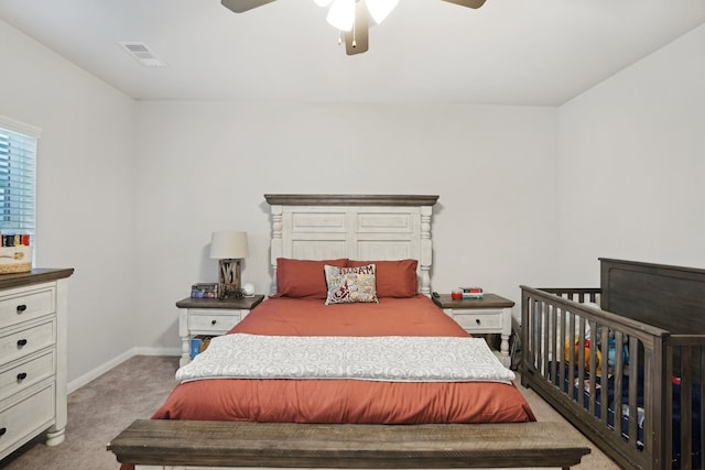 bedroom featuring ceiling fan and light colored carpet