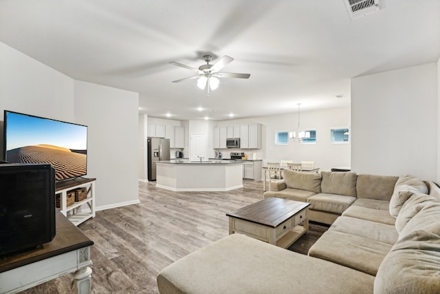 view of front of house featuring a front yard, a garage, and central AC unit