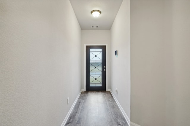 doorway featuring wood-type flooring