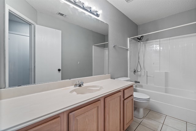 full bathroom featuring toilet, tile patterned flooring, a textured ceiling, vanity, and bathtub / shower combination