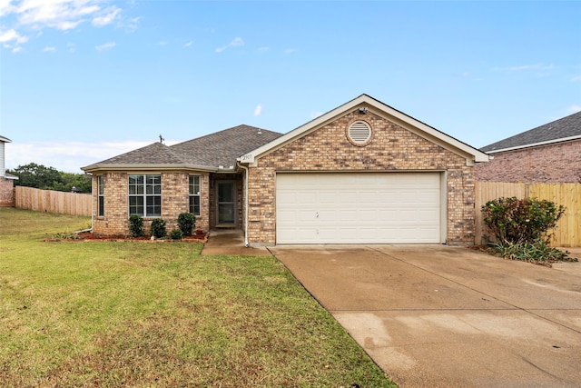 single story home with a garage and a front lawn