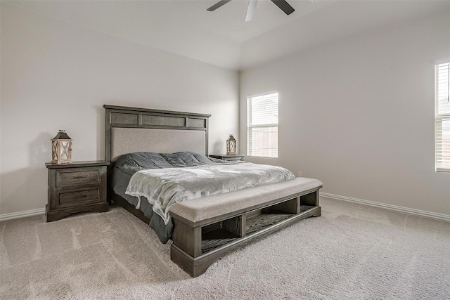 carpeted bedroom featuring lofted ceiling and ceiling fan