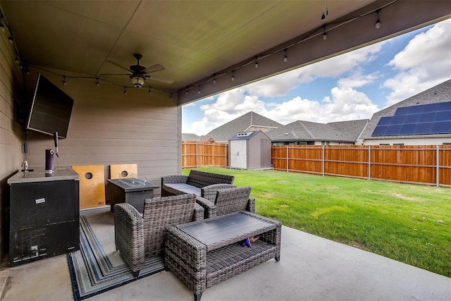 view of patio with a storage unit and ceiling fan