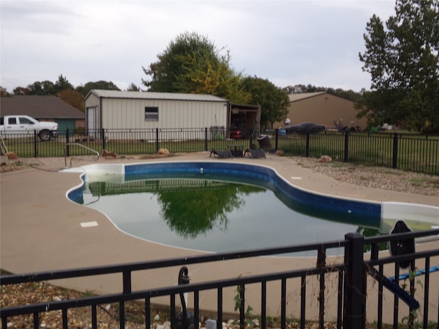 view of swimming pool with a patio area