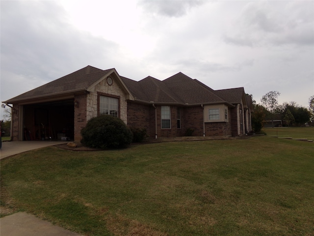 single story home with a front lawn and a garage