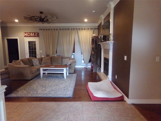 tiled living room featuring ornamental molding