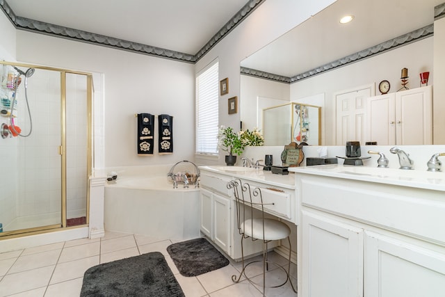 bathroom with tile patterned flooring, shower with separate bathtub, and vanity