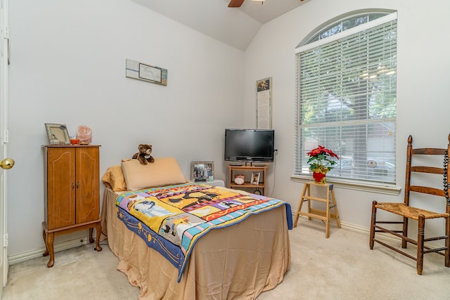 bedroom featuring ceiling fan, light colored carpet, and lofted ceiling