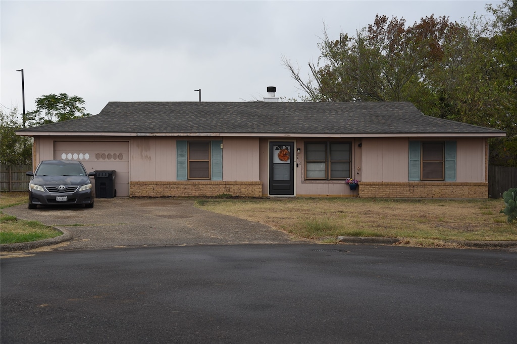 ranch-style home with a garage