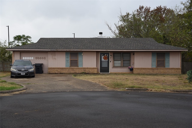 ranch-style home with a garage