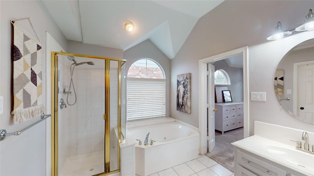 bathroom with tile patterned floors, vanity, lofted ceiling, and independent shower and bath