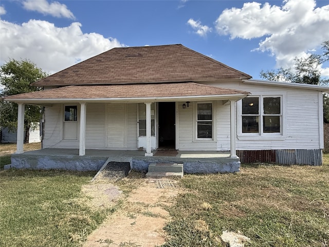 view of front of home with a front lawn and a porch