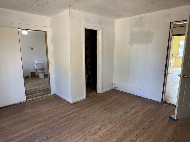 spare room with dark hardwood / wood-style floors