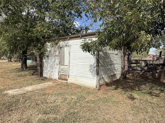 view of property exterior with a storage shed