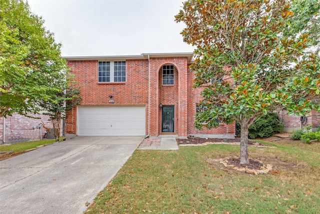 view of front of property with a garage and a front yard