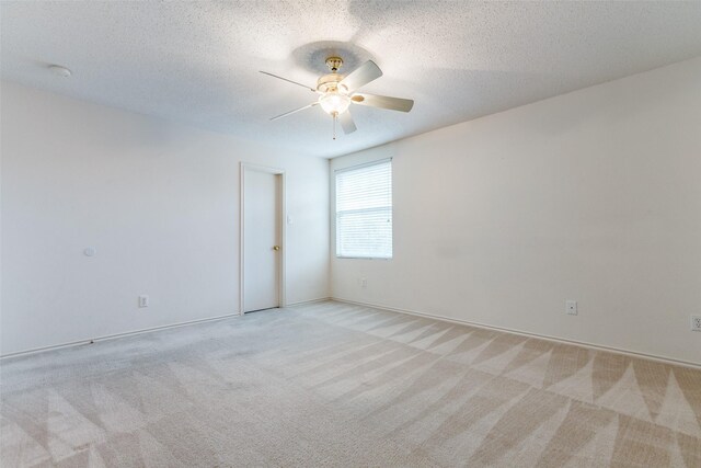 unfurnished room featuring light colored carpet