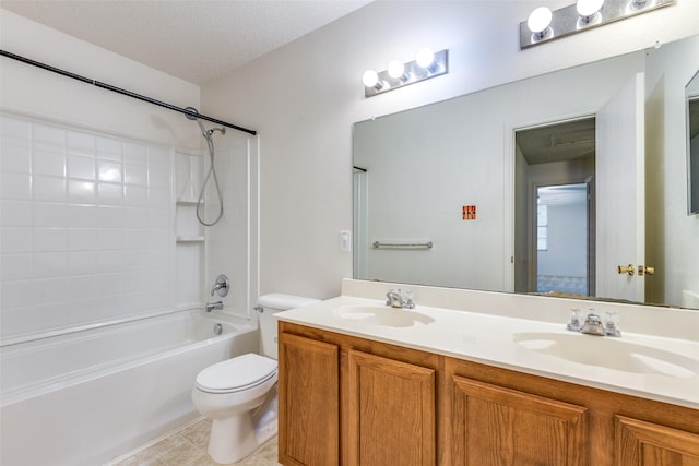 full bathroom with tile patterned floors, vanity, a textured ceiling, shower / washtub combination, and toilet