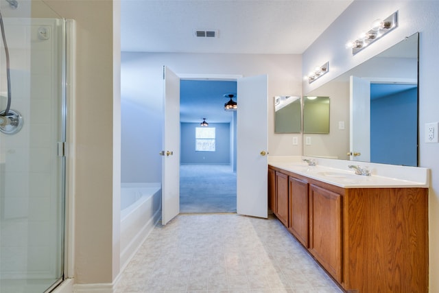 bathroom with vanity and plus walk in shower