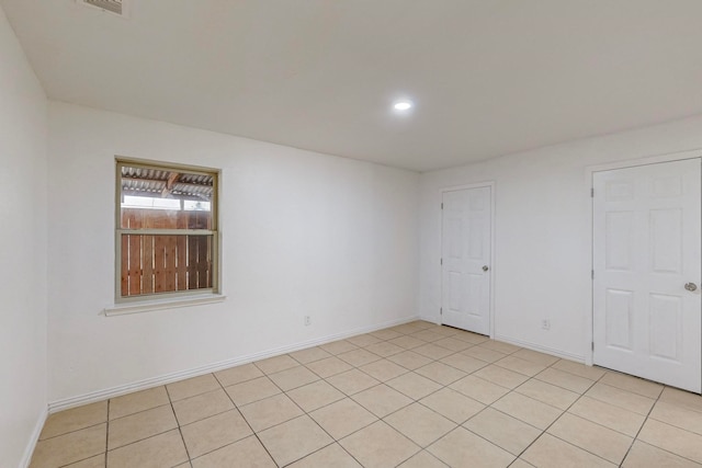 empty room with light tile patterned flooring