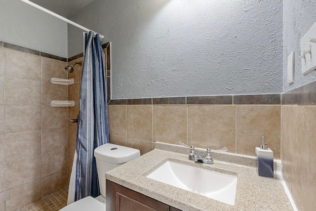 bathroom with vanity, a shower with curtain, and toilet