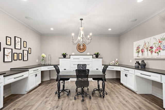 interior space with light hardwood / wood-style floors, a notable chandelier, and crown molding