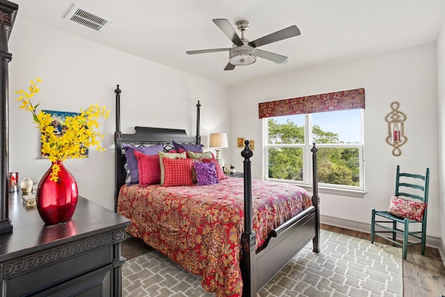 bedroom with hardwood / wood-style flooring and ceiling fan