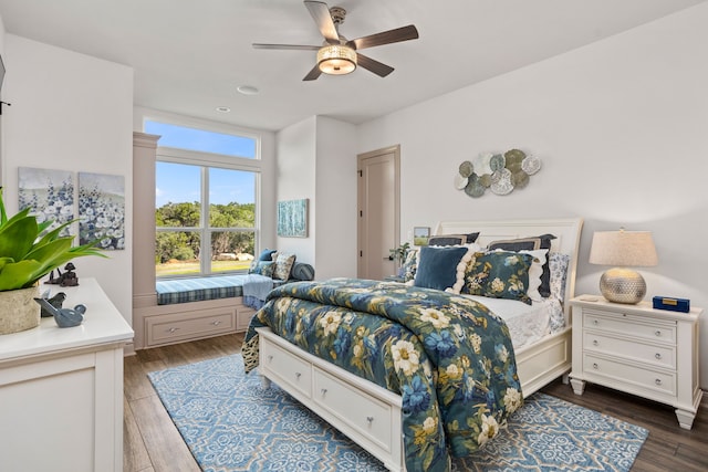 bedroom with dark wood-type flooring and ceiling fan