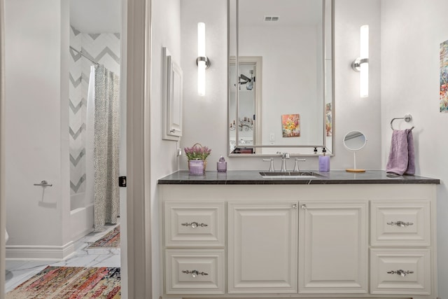 bathroom featuring vanity and shower / tub combo