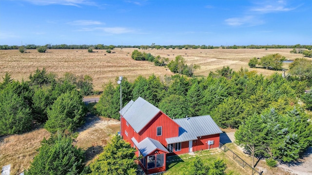 birds eye view of property with a rural view