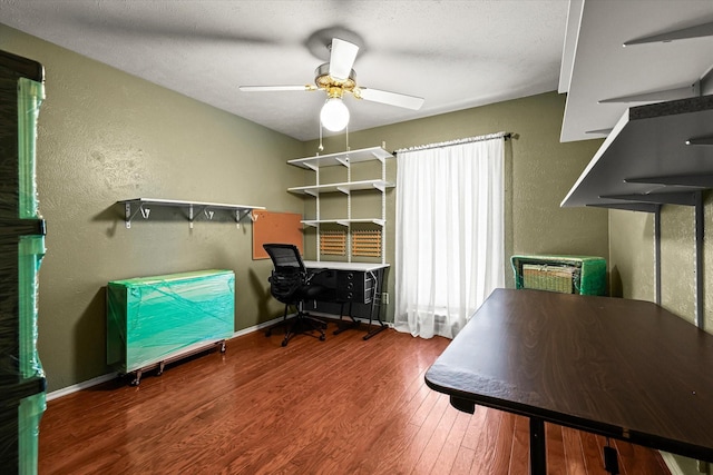 home office with ceiling fan and hardwood / wood-style flooring