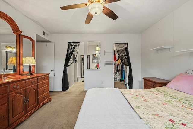 bedroom with light colored carpet and ceiling fan