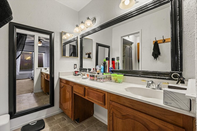 bathroom featuring vanity, tile patterned floors, and ceiling fan