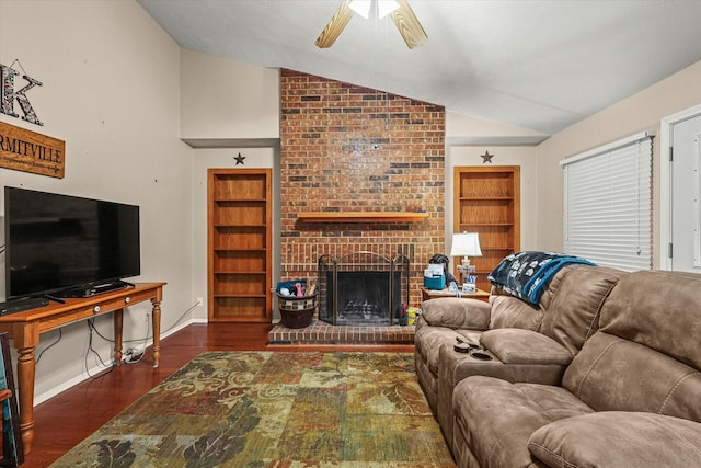 living room with a brick fireplace, ceiling fan, built in features, dark hardwood / wood-style floors, and lofted ceiling