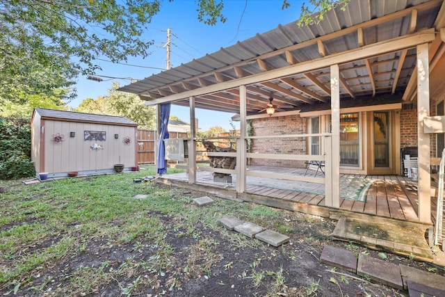 view of yard with a storage shed and a wooden deck