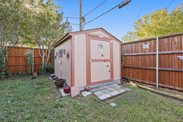 view of shed featuring a fenced backyard