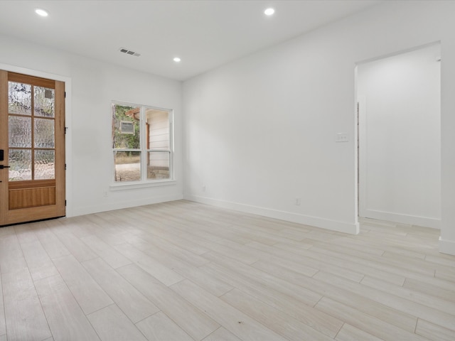 empty room with light wood-type flooring