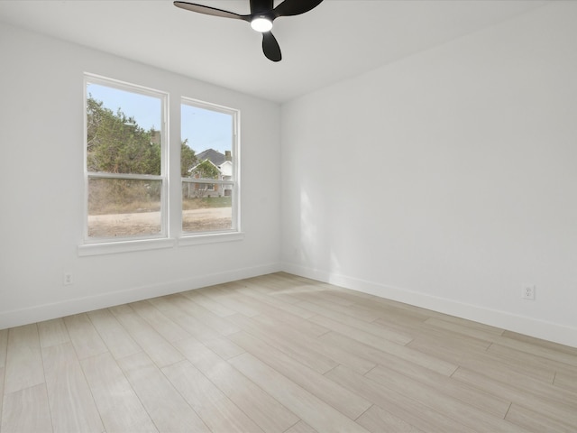 spare room with ceiling fan and light hardwood / wood-style flooring