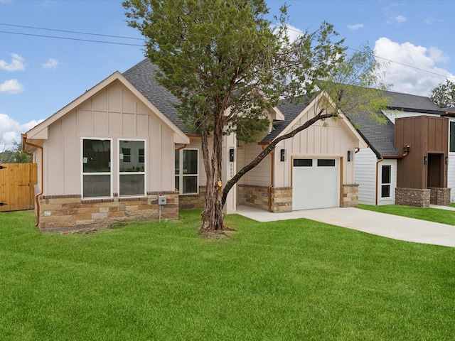 modern inspired farmhouse with a front yard and a garage