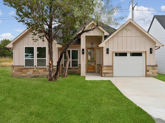 modern inspired farmhouse with french doors, a front lawn, and a garage