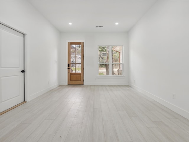 spare room featuring light hardwood / wood-style flooring