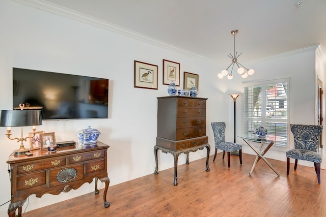 living area featuring an inviting chandelier, wood-type flooring, and crown molding